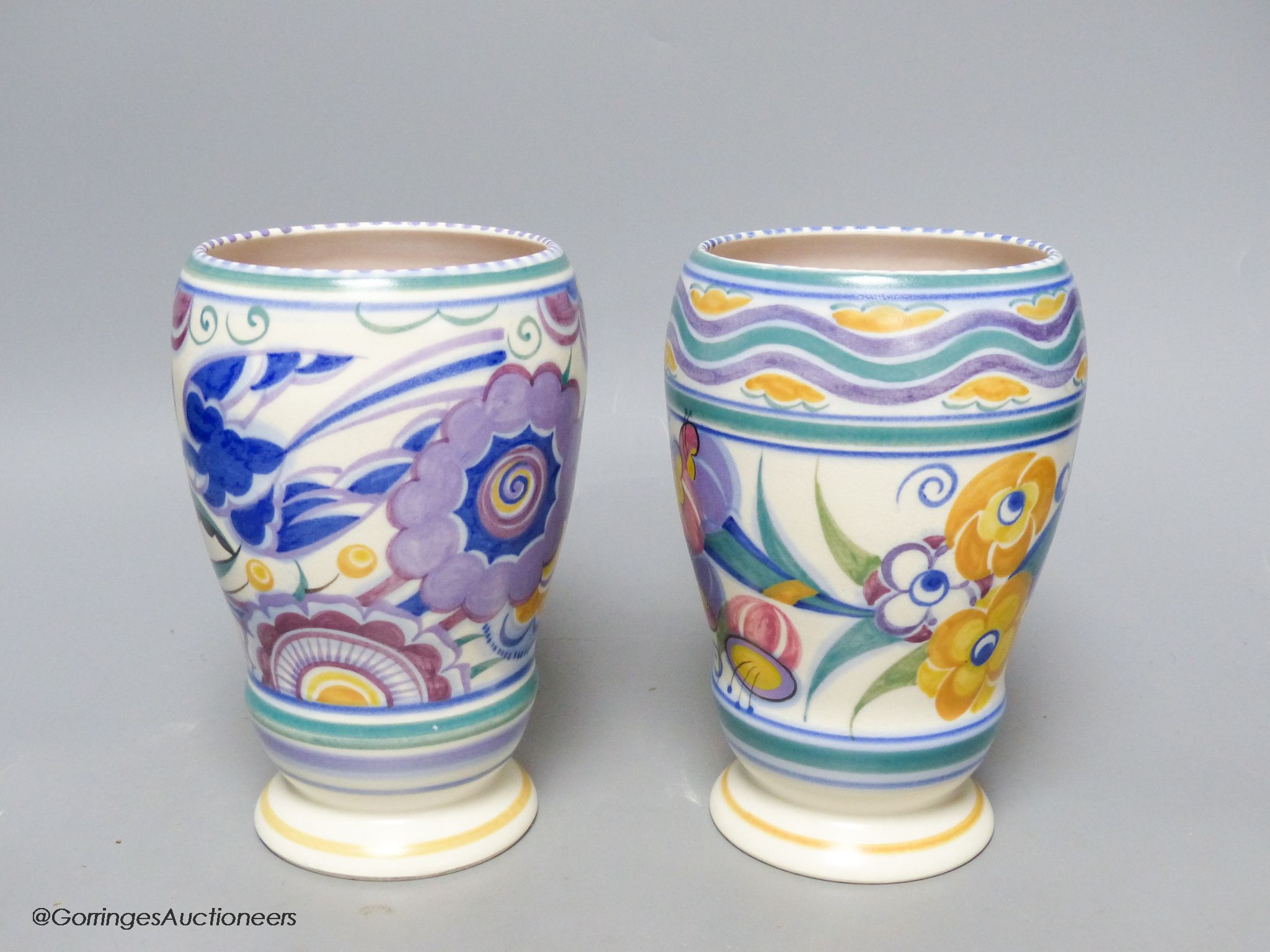 Two 1930's Poole Pottery polychrome vases, height 18cm